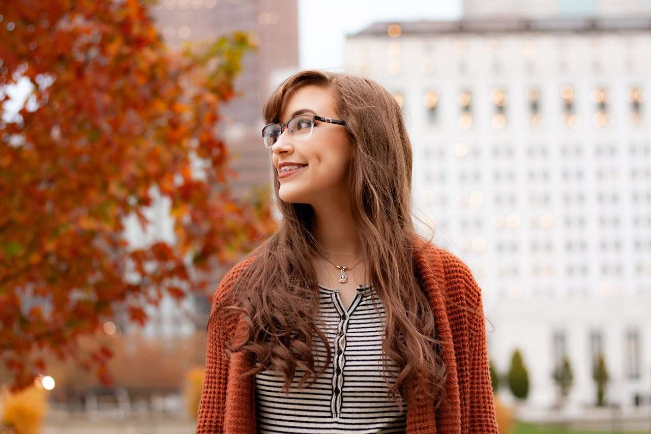 Clear Aligners vs. Braces a female smiling with braces